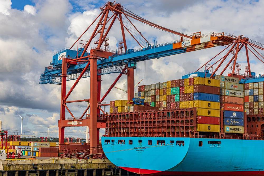 Container cranes loading a cargo ship at a marine terminal